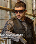 Person wearing Wide Vision Lab Safety Goggles For Chemical Splash Protection with black-orange frame in an industrial setting