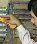 Technician using heavy duty wire tracer and cable tester kit with alligator clips RJ11 and RJ45 connectors in telecom closet.