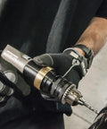 Pro Grade Half Inch Pneumatic Reversible Drill With 800 RPM Lightweight Aluminum Body in use for metalwork