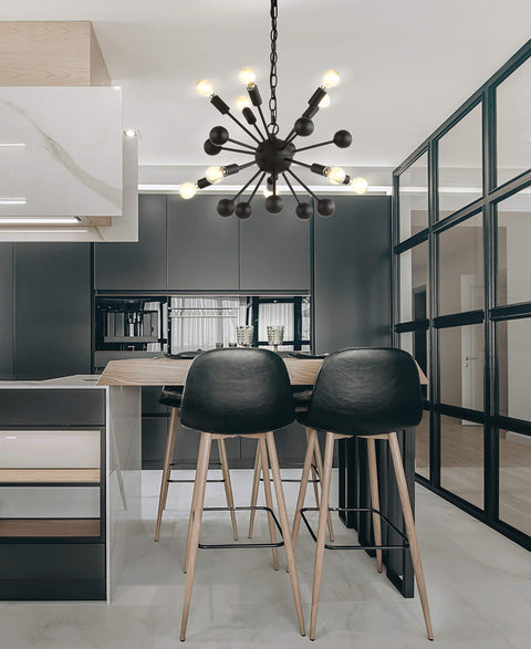 19.5-Inch Black 10-Light Iron Sputnik Chandelier hanging in modern kitchen setting with black cabinets and bar stools.