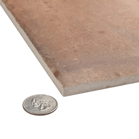 Close-up of Porcelain Floor And Wall Tile Eight And Three Quarters Inch Square Glazed With A Medium Textured Finish next to a coin