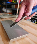8 Inch Diamond Dia Sharp Whetstone Bench Stone With Medium Extra Fine Grit Sharpener, used with a chisel on a workbench.