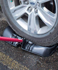 Car tire on snow shovel showing Beast Of A Snow Shovel With Wide Scoop And Fiberglass D-Grip For Driveways in use