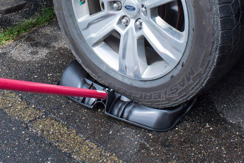 Car tire on snow shovel showing Beast Of A Snow Shovel With Wide Scoop And Fiberglass D-Grip For Driveways in use