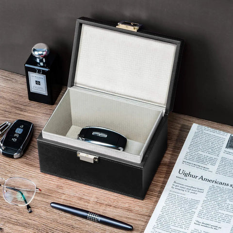 Faraday Box Key Fob Protector For Car Keys, RFID Signal Blocking Shield, open on table with car keys and newspaper nearby.