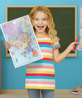 Child holding Europe Map 11x17 Laminated Dry Erase Chart, Double-Sided With Color Front And Blank Outline Back in classroom.