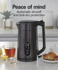 Digital Temperature Control Electric Tea Kettle 1.7L Fast Boil 1500W With 5 Presets Keep Warm BPA Free Double Wall Stainless Steel Cordless Black on counter.