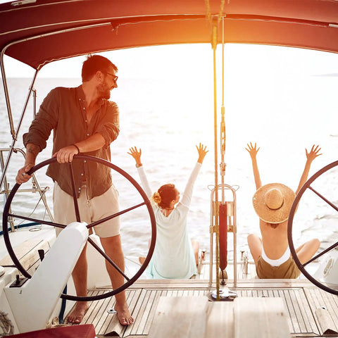 Sailors enjoying sunset on deck, showcasing Four Pieces Bimini Top Caps For Seven Eighths Inch OD Round Tubing Stainless Steel External Eye End Boat Fittings Marine Hardware Beefed Up For Tough Marine Use