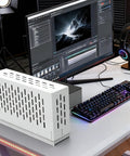 Top Shelf External Gpu Docking Station For Laptops With Pcie Four Point Zero Link And A Beefed Up Metal Case on a desk