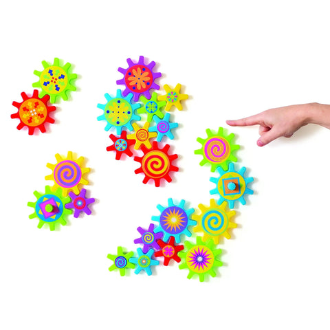 Colorful Magnetic Gear Building Set For Kids 4 To 8, 22 Piece STEM Learning Kit with child pointing at gears on white surface