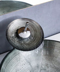 USZWBY Tempered Glass Bathroom Vessel Sink with waterfall faucet, round shape, spiral pattern, showcasing water flow.