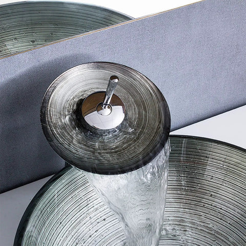 Tempered Glass Bathroom Vessel Sink, Round Shape Spiral Pattern Spiral Artistic Vessel Bowl Sink With Waterfall Faucet pouring water