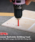 Pink cordless drill with black chuck drilling a red 1/4-inch diamond drill bit into beige tile.
