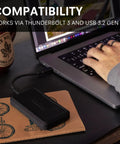 Beast 2TB External NVMe SSD With Thunderbolt 3 Ultra Fast 2800 MBs Read 2600 MBs Write For 4K 8K Editing VR And Big Media Backups, black aluminum enclosure on laptop desk