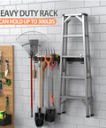 Wall-mounted 48 Inch Garage Tool Organizer with hooks holding shovels, rakes, and ladder in garage setting.