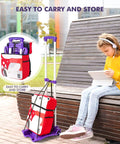 Side view of purple Home-Man folding hand truck with 4 wheels and elastic straps, carrying luggage.