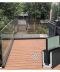 Tough As Nails Deck Railing Glass Spigot Clamp With Side Mount Bracket on wooden deck with screws, heavy duty aluminum for pool fencing.