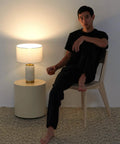Arden LED Table Lamp With USB Port Charge Your Phone Or Tablet Bedside Reading Light on nightstand in cozy setting