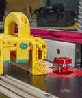 Kickback Buster 3D Push Block With Gravity Heel Kit For Table Saws, yellow plastic, securely holds wood for safe routing.