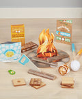 Campfire S'mores Pretend Play Set with 23-piece toy food kit, including toasted marshmallows, logs, fire pit mat, and kitchen accessories