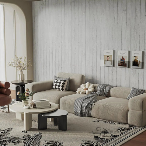 Living room with beige sofa, floral rug, and wall covered in White Gray Wood Peel And Stick Wallpaper 17.71 Inches Wide By 32.8 Feet Long Self Adhesive Vinyl Wall Covering Removable Decorative Paneling Film With Realistic Dope 3D Grain For Easy DIY Home Makeovers.