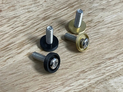 Orange License Plate Screws Set Of Four Stainless Steel Fasteners For Front Or Rear Plates On Cars Trucks And SUVs Rustproof Self Tapping M6 Aluminum Caps With Washers For Dry Or Wet Weather Easy Install No Fuss shown on wood surface
