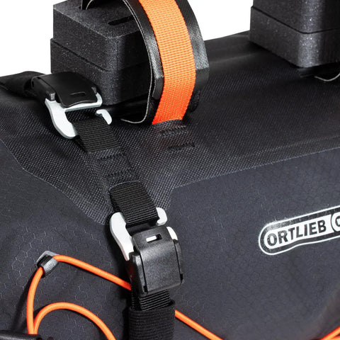 Handlebar Pack For Bike With Dual Roll Closures For Quick Access, Camlock Strap Hook, Easy Steering Tube Belt Adjustment, Air Release Valve With Pull String, 15 Liter Capacity, Compact, Ride Ready Storage close-up detail of strap and hook