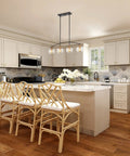 Industrial Farmhouse Island Light With Clear Glass Globe Shades 34 Inch Four Light Modern Linear Pendant in a kitchen setting