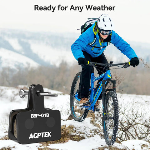 Mountain biker in snow with Beefy Stopping Power Low Noise Resin Disc Brake Pads for Mountain Bikes shown in foreground