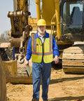 Level Up Your Road Ready Look With This Dope Yellow Hi Viz Safety Vest Featuring Bold Retro Reflective Stripes And Comfortable Unisex Fit For Day Or Night Shifts on a construction site.