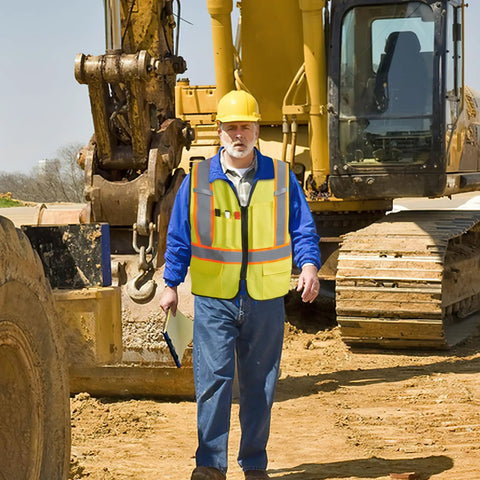 Level Up Your Road Ready Look With This Dope Yellow Hi Viz Safety Vest Featuring Bold Retro Reflective Stripes And Comfortable Unisex Fit For Day Or Night Shifts on a construction site.