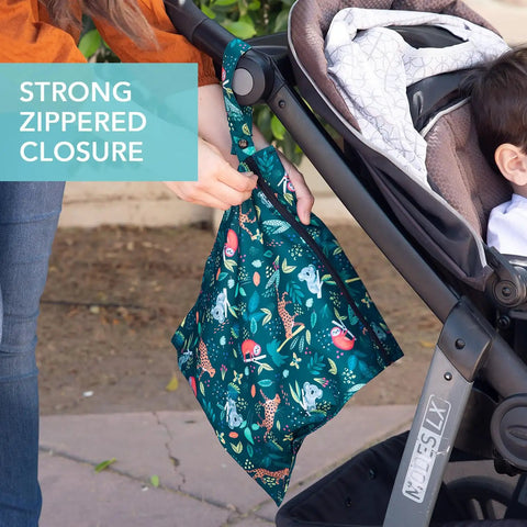 Person attaching Super Handy Waterproof Wet Bag Two Pack For Travel And Beach to stroller, showing strong zippered closure