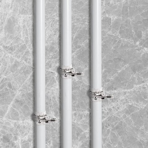 Three installed stainless steel pipes with heavy duty 2 inch tri clamp sanitary pipe fittings, weld ferrules, wing nuts, and gasket.