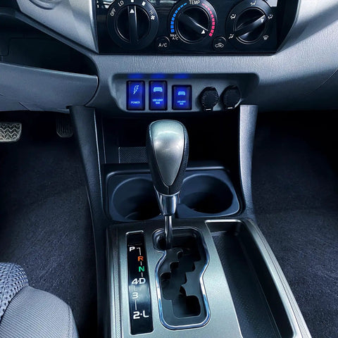Dashboard view of Toyota with Easy Install No Fuss 12V Push Button Switch With Wire Kit installed, showing blue LED lights.