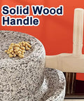 No Fuss Manual Stone Grain Mill With Hand Crank For Dry And Wet Grinding, granite stone with wood handle, nuts on stone surface