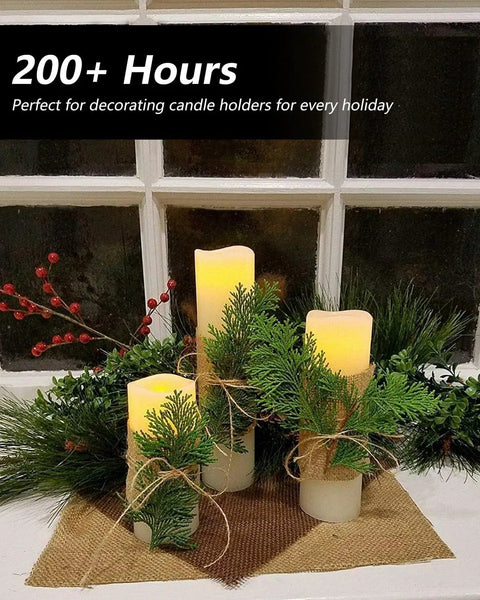 Flameless LED Candle Set Of 10 Pillar Candles Waterproof Resin For Indoor Outdoor Use Ivory With Realistic Flickering Flame And Warm Yellow Glow Battery Operated Heights 4 5 6 7 Inches with greenery decoration.