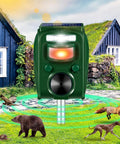 Solar Ultrasonic Animal Repeller With Five Frequency Modes, Motion Sensor, And Strobe Light shown installed in a yard