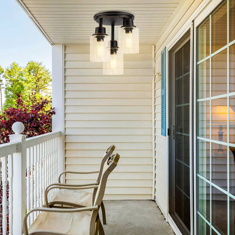 Three Light Semi Flush Mount Ceiling Light With Vintage Oil Rubbed Bronze Finish And Clear Seeded Glass Shades on porch