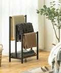 Free Standing Towel Rack And 3 Tier Blanket Organizer Space Saver For Home No Clutter Industrial Metal Drying And Display Rack With Shelf Rustic Brown And Black Finish Great For Bath Laundry Living Room 16.9 In Long 11 In Wide 31.9 In High displaying towels.