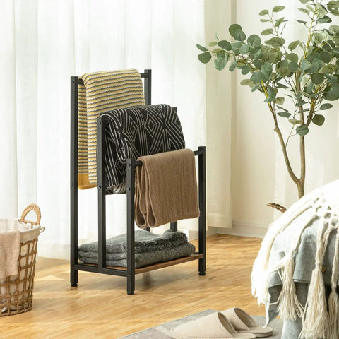 Free Standing Towel Rack And 3 Tier Blanket Organizer Space Saver For Home No Clutter Industrial Metal Drying And Display Rack With Shelf Rustic Brown And Black Finish Great For Bath Laundry Living Room 16.9 In Long 11 In Wide 31.9 In High displaying towels.