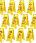 Heavy Duty Folding Wet Floor Signs, Set Of Twelve Double Sided Bilingual Safety Placards For Shop And Office Floors, Bold Yellow Warning Markers displayed in a row.