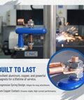 Heavy Duty Super Magnetic Welding Support Clip With Strong Suction Adjustable Magnet Clamp For Copper Tail Ground Connectors And Pro Welders Using Durable Gear shown attached to a metal pipe.