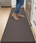 Extra Long Anti Fatigue Kitchen Mat Cushioned Memory Foam Runner Rug 70 By 20 Inches Waterproof Non Slip Backing For Standing All Day At Desk Sink And Laundry In Brown in use on kitchen floor