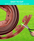 Close-up of Durable Flexible 4 Inch Landscape Edging Coil Kit With 30 Spikes For Lawn Borders And Flower Beds 33 Feet being cut.