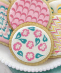 Top Shelf Cookie Decorating Tools Set Featuring Etching Wand Triple Comb And Flexible Silicone Scraper For Bakin Crews Crafting sleek floral icing designs on cookies.
