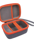 Interior view of orange Hard EVA Case For Kids Music Player With Velvet Lining Travel Storage Bag showing mesh pockets.