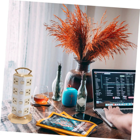 Heavy Hitter Power Strip With Quick Juice USB Ports And No Hassle Surge Guard on a desk with a laptop and decor.