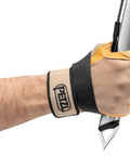 Close-up of hand gripping Glacier Linkin Ice Axe With Leash 68cm, grooved shaft, steel pick for tech ice climbing.