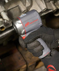 Half Inch Air Impact Wrench With Quiet Technology Up To 650 Foot Pounds Of Torque Ultra Compact And Light Weighs About Two Point Four Pounds Max Control For Big Jobs Like Heavy Duty Assembly And Suspension Work being used on machinery