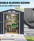 7x4 Outdoor Metal Storage Shed With Foundation Kit, double lockable doors open, storing garden tools in dark gray